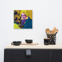Square Beethoven Blond Blue canvas above kitchen counter with black bowls and wood utensil caddy.