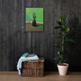 Goya Black Duchess Green Pink canvas on dark wood-slat wall above wicker chest and rubber plant.