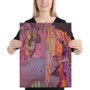Woman in black shirt holding rectangular Botticelli Venus Orange Purple neon pink canvas.