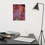 Vertical Botticelli Venus Orange Purple canvas above black desk with silver laptop and tripod lamp.