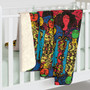 Klimt Beethoven Portrait sherpa blanket over white crib rail with cream fleece lining folded over.