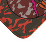 Corner detail of orange-pink Vitruvian Space Man mat showing camo print and orange edge binding.