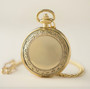 Closed Da Vinci Golden Pocket Vitruvian Man watch: polished gold filigree cover with curb chain.