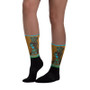 Green, orange, blue, and black socks with Rembrandt Winner artwork