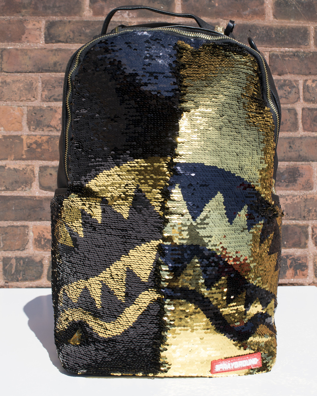 Sprayground sharks in Paris gold drip backpack