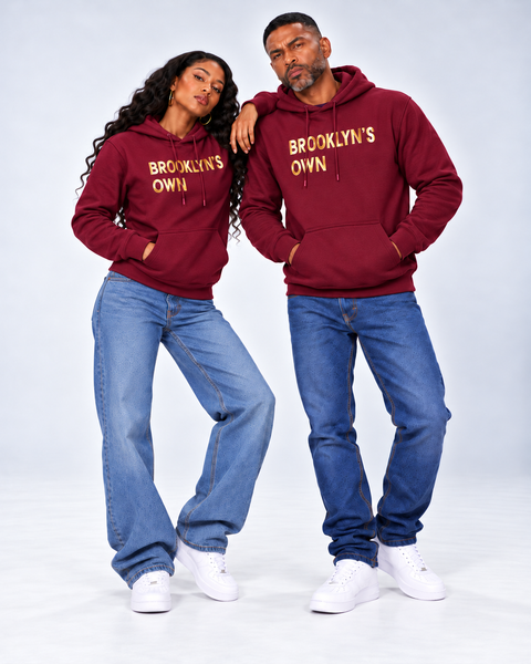 Man and woman wearing a Brooklyn's Own Merlot unisex Hoodie