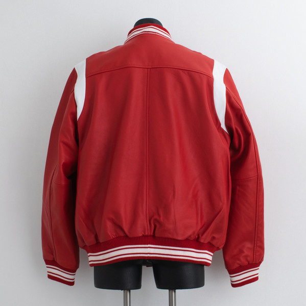 back view of red and white leather jacket on mannequin
