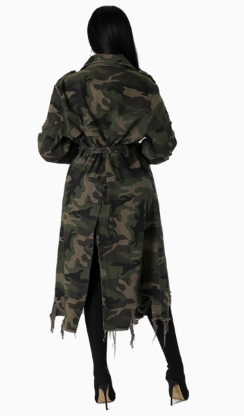 Side view of women’s distressed camo trench coat with relaxed fit and long silhouette