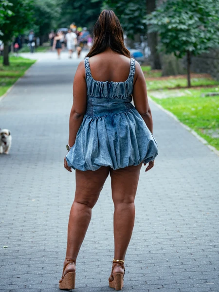 Plus size bubble hem denim dress styled for summer streetwear