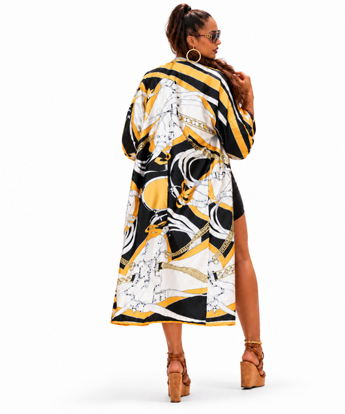 woman wearing a  long duster kimono with luxury-inspired chain print