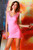 Pink V-neck lace cocktail dress with beaded neckline and embossed skirt by Atina Collection