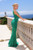 Green sheer form fitting gown with bust pad