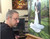 Live wedding painter Jess Perna in studio finishing painting.