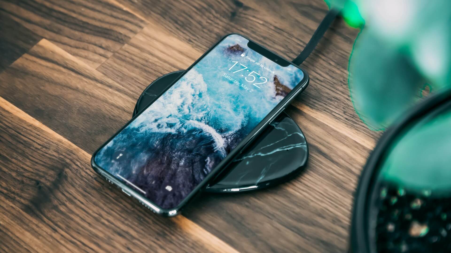 an iPhone on a wireless charger