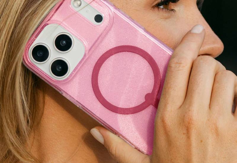 woman holding a milan snap glitter iphone case