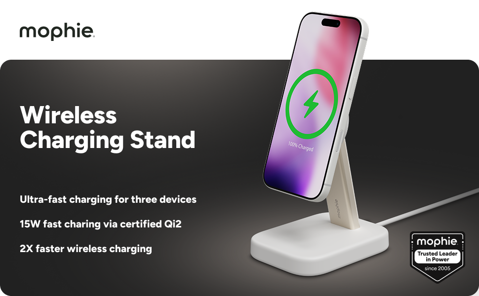 Mophie wireless charging stand with iPhone upright. Text highlights 15W Qi2 fast charging, ultra-fast charging for three devices, and 2X faster wireless charging