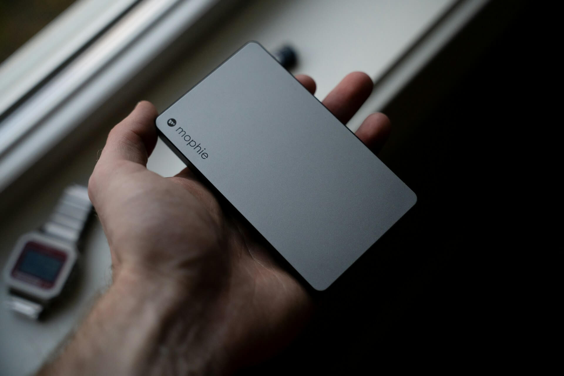 person holding Mophie power bank