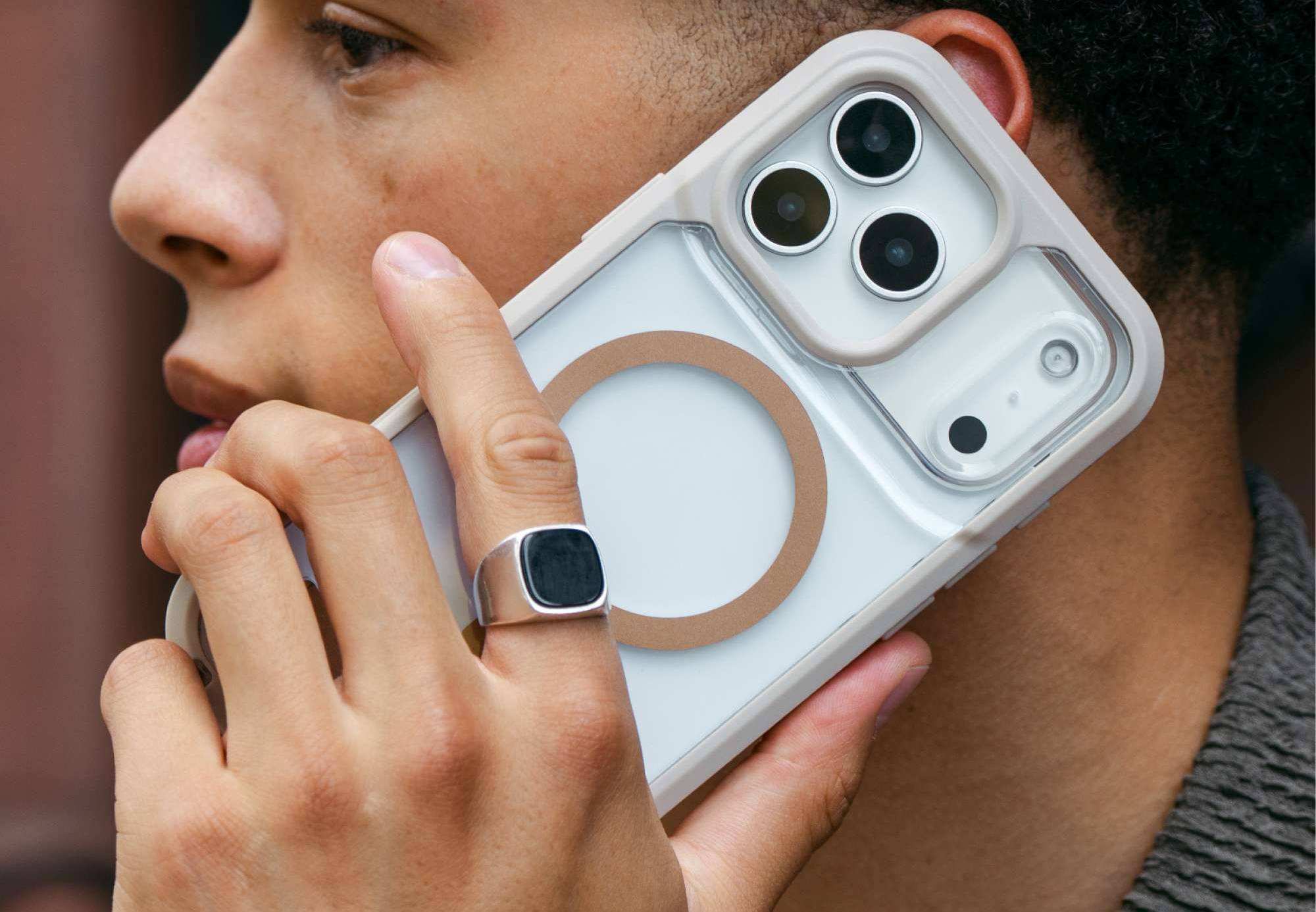 man holding a phone in a rainer snap iPhone MagSafe case