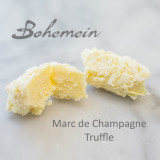 Bohemein Marc de Champagne Truffle. A white chocolate delight. Sweet White chocolate truffle with a hint of the flavour of Bubbly wine. Dipped and rolled in more white chocolate.