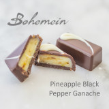 Bohemein Pineapple Black Pepper Ganache.Tangy tropical pineapple spiked with gently smoked granules of pepper, encased in dark chocolate.