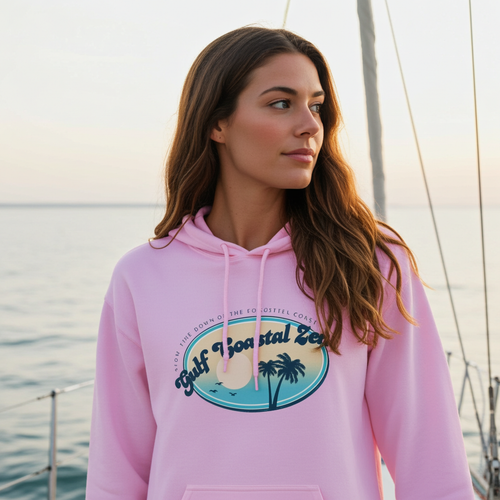 Woman on sailboat wearing Gulf Coastal Zen palm tree logo hoodie