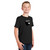 Front of model wearing Beach Squad Positive Energy Acorn Youth Short Sleeve shirt in Black