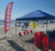 Beach Squad Beach Cleanup tent with cleanup flag and signs in Daytona Beach