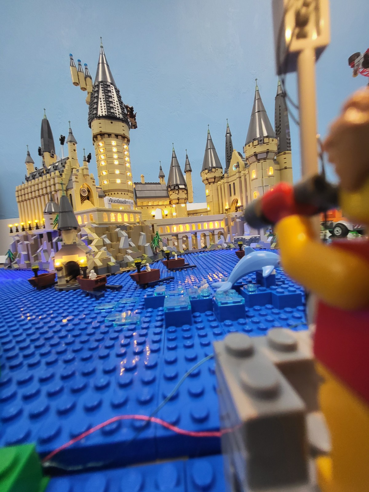 Beach Squad Lego Window Display mini scene guy looking through binoculars at Hogwarts Castle lit up