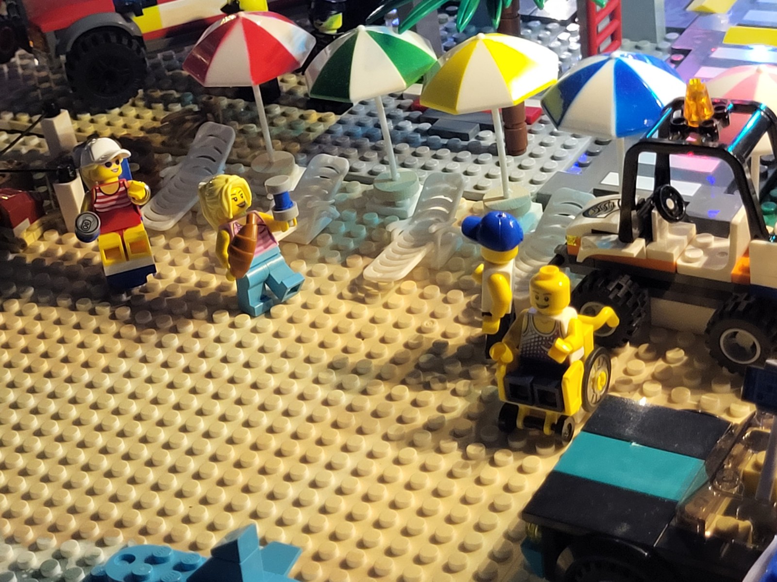 Beach Squad Lego Window Display Mollie and Kyle and Robyn Allen and Leisa Beach umbrellas