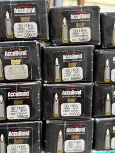Nosler AccuBond 165gr Spitzer bullets feature a bonded lead core, tapered jacket, and white polymer tip for controlled expansion, deep penetration, and excellent accuracy—ideal for hunting medium to large game with .30 caliber rifles. Nosler AccuBond 165gr Spitzer bullets feature a bonded lead core, tapered jacket, and white polymer tip for controlled expansion, deep penetration, and excellent accuracy—ideal for hunting medium to large game with .30 caliber rifles.