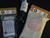 Ally Munitions Hunt Saver Kit, Life Saver Kit, and CAT Gen 7 Tourniquet lineup displayed together with minimalist waterproof first aid packaging, trauma supplies, emergency field manual, quick reference card, and hunting-focused outdoor medical equipment designed for hunters, ranchers, campers, field workers, and outdoor emergency preparedness.