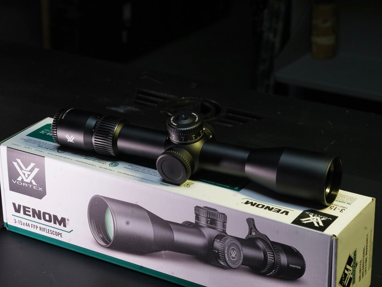 Close-up of Vortex Venom scope showing exposed elevation turret and EBR-7C reticle