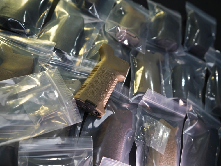 Used AR-15 pistol grips including Magpul, BCM, B5, and mil-spec style grips with various finishes and conditions inspected by Ally Munitions.