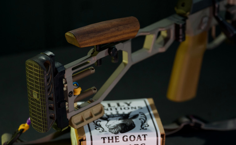 Sobchak Security Old Hickory Walnut Riser installed on a Q Fix rifle, featuring adjustable comb height and negative comb geometry for improved rifle fit and recoil management.