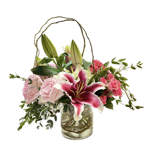 This is a prefect design to enhance any home or office space, and will certainly make a statement! Curly willow encircles this combination of hydrangea, roses, lilies and ranunculus to draw attention to the premium, delicate blooms. A clear glass cylinder