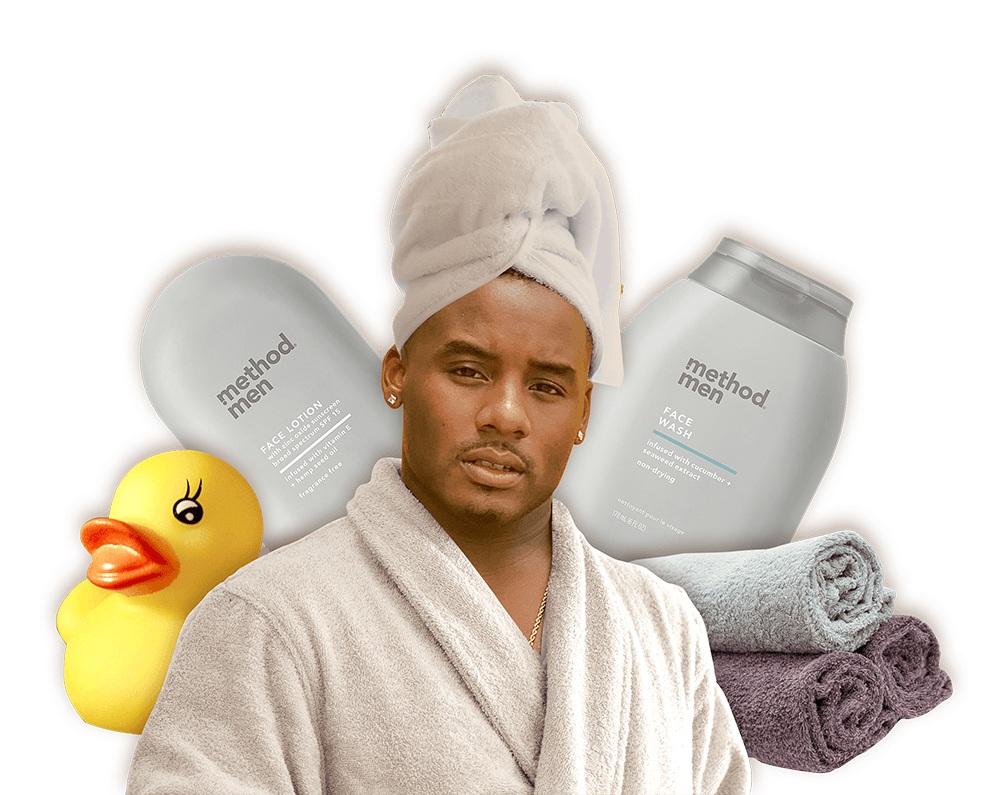 James Henry wearing robe and head towel with towels and Method Face wash in the background.