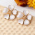 White floral enamel stud earrings