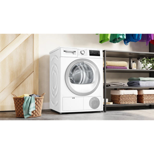 Bosch Series 4 8Kg Condenser Tumble Dryer - White - Tumble dryer in utility room shot Bosch Series 4 8Kg Condenser Tumble Dryer - White - Tumble dryer in utility room shot