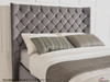 Thea gas lift ottoman bed shown in charcoal smooth velvet fabric with diamante button