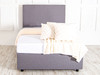 Elevate your sleep space with the Esupasaver Irène Upholstered Bed. Crafted in the UK, it features luxurious fabrics and a sturdy design with a chic headboard.