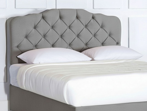 Elevate your bedroom with the Esupasaver Zoe Bed Headboard, featuring elegant curved accents, deep buttoning, and sturdy wooden struts for lasting style.