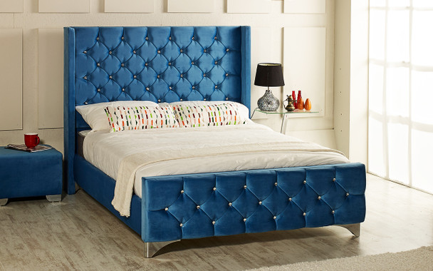 Ferrara upholstered bed shown in soft velvet fabric, chrome feet, and diamante buttons.