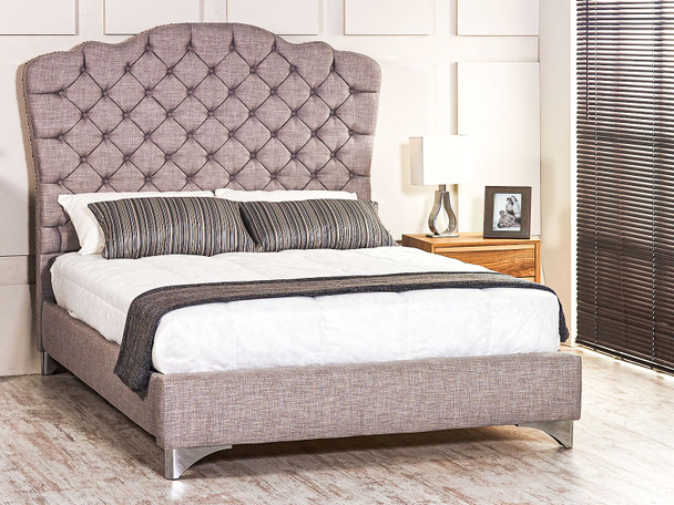 Discover the Esupasaver Stirling Upholstered Bed, featuring a stylish curved headboard, deep buttoning, and options for chrome or wooden feet.