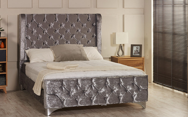 Sparta Wing Back upholstered bed frame shown in ice crush velvet fabric with diamante button and chrome  feet.
The Esupasaver Bed Company Quality Beds Made in England