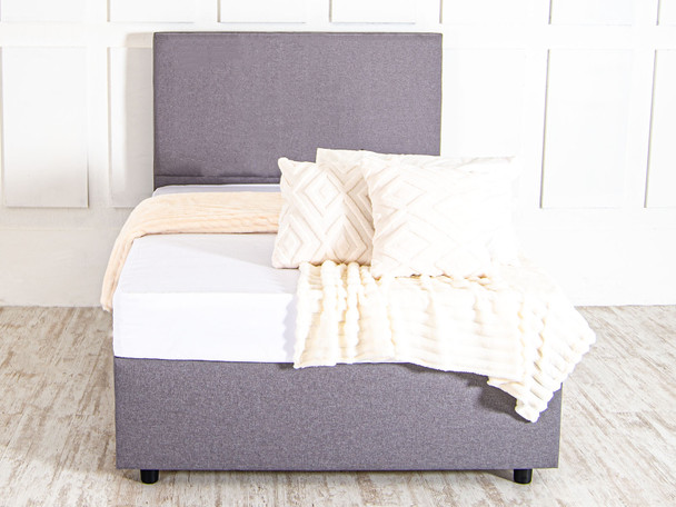 Elevate your sleep space with the Esupasaver Irène Upholstered Bed. Crafted in the UK, it features luxurious fabrics and a sturdy design with a chic headboard.