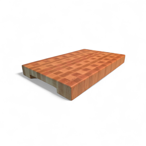 alt="Angled view of a 5cm thick handmade end-grain cutting board, crafted entirely from bright American Maple wood with carved side handles."