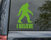 I Believe Bigfoot Sasquatch vinyl decal featuring a walking hairy cryptid silhouette above bold I BELIEVE lettering for cars trucks RVs and campers