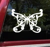 Decorative butterfly vinyl decal with ornamental curls and swirling wing design