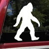 Walking Bigfoot Sasquatch silhouette vinyl decal featuring a shaggy cryptid with long arms and large feet on a vehicle window