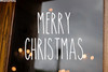 Merry Christmas vinyl decal with tall skinny handwritten lettering arranged in two lines for holiday doors and windows